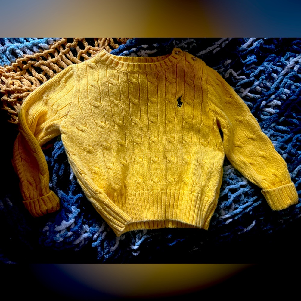 A vibrant yellow “Polo, by Ralph Lauren” knit sweater, perfect for your kiddo!